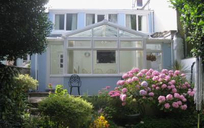 Garden showing conservatory 